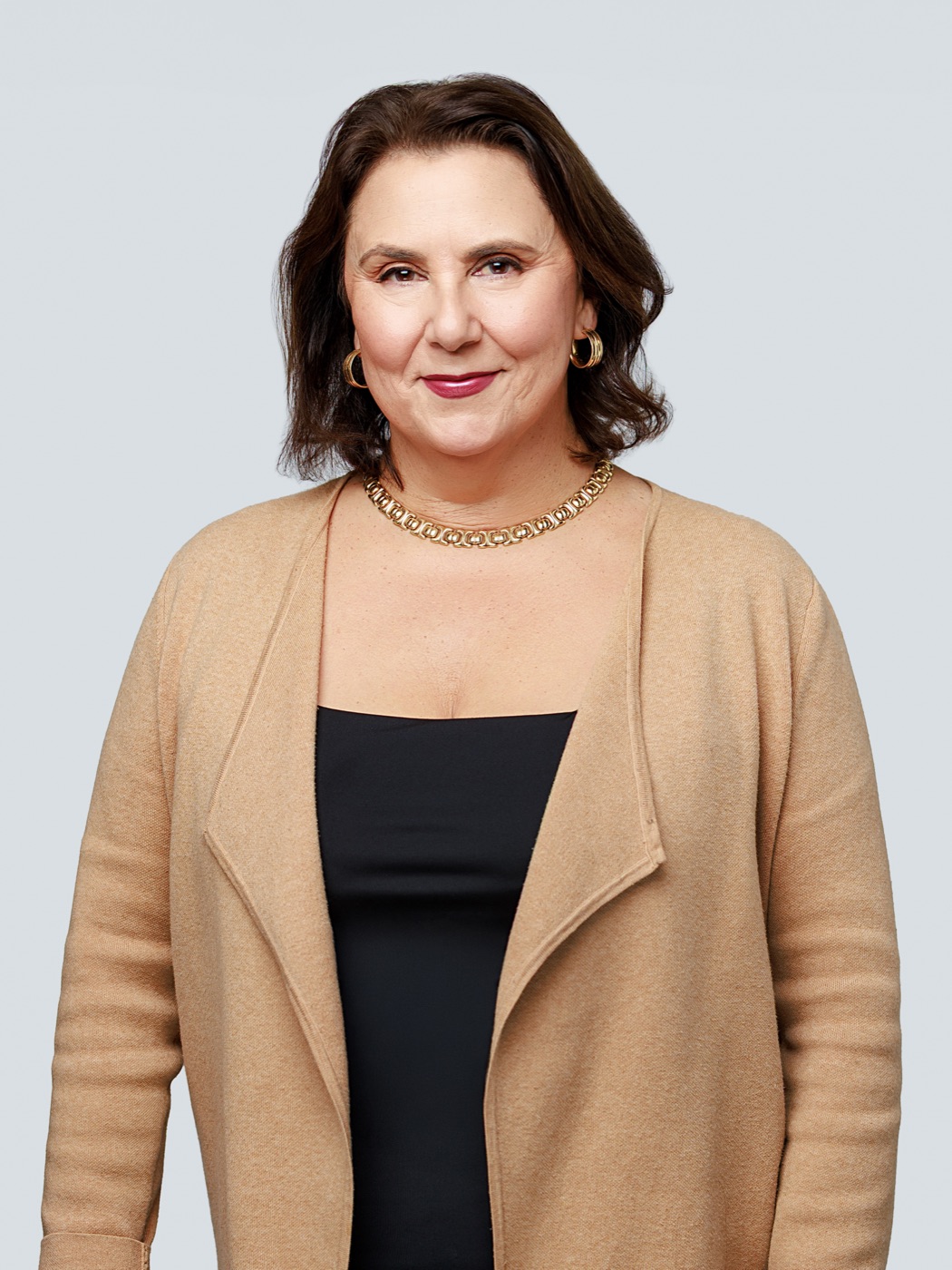 Nikki Dumas, Founder and Managing Broker, standing portrait