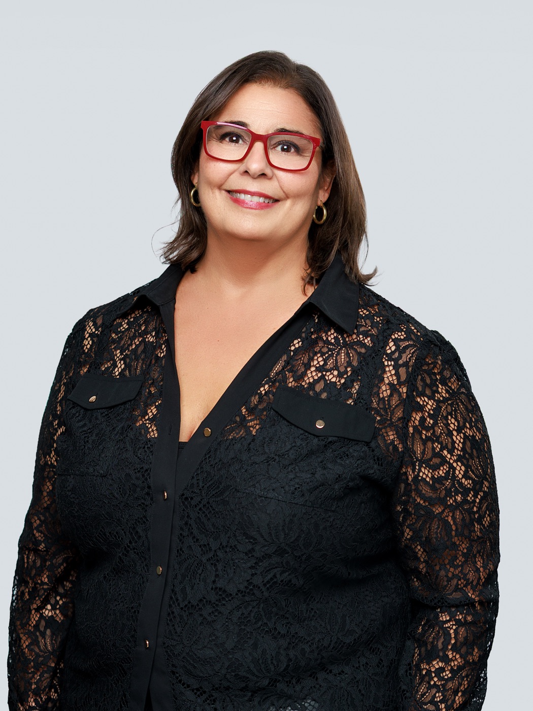 Stacie Dumas, Broker Associate, standing portrait in black